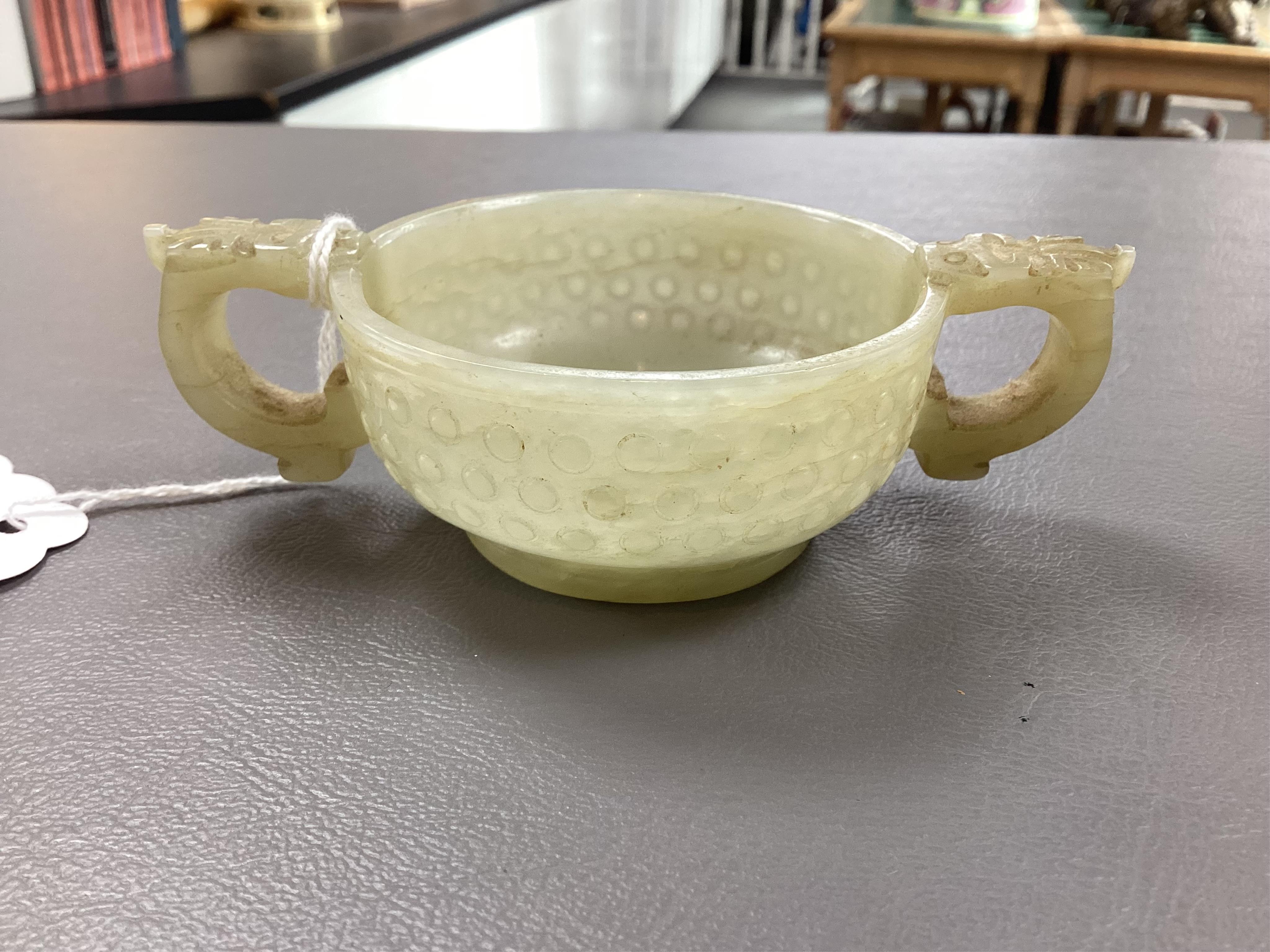 A Chinese pale celadon and russet veined jade cup, 17th century